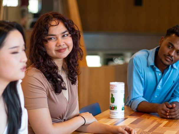 Students smiling at each other