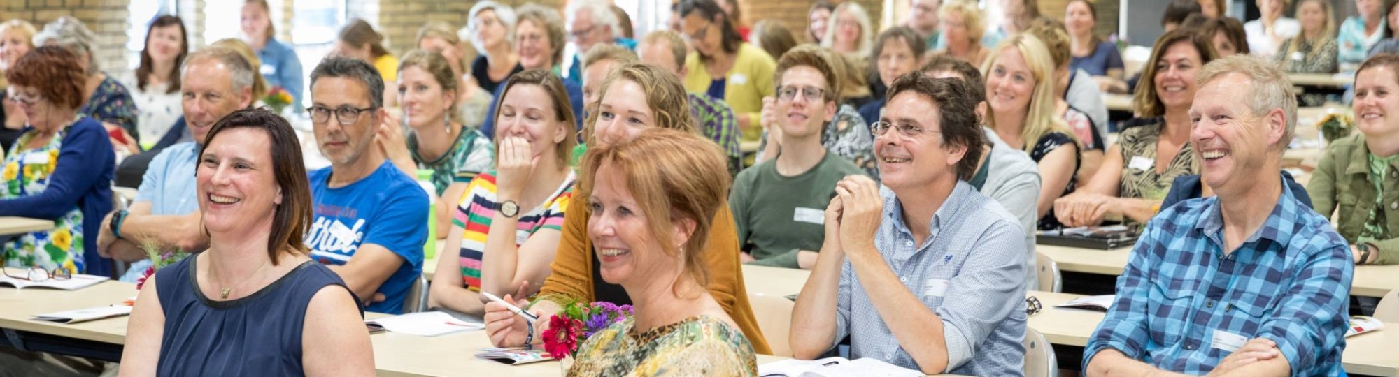 symposium zaal voorin programmamanagers