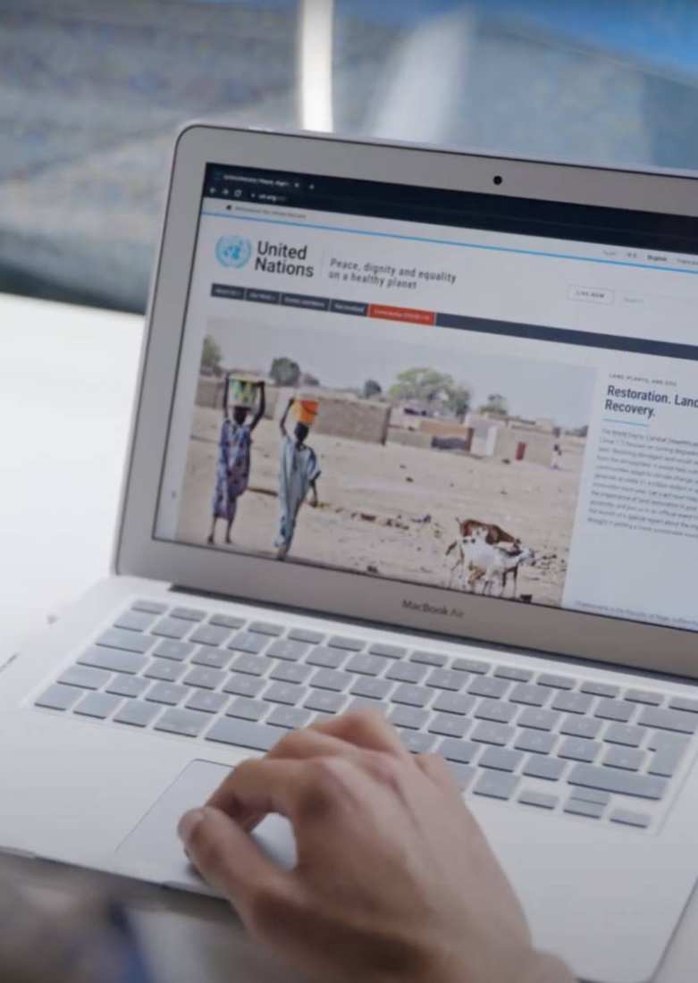 Tiago from Portugal looks up info on the United Nations on his laptop