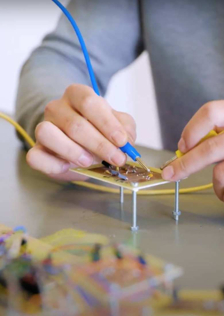 Student Danila working on a circuit