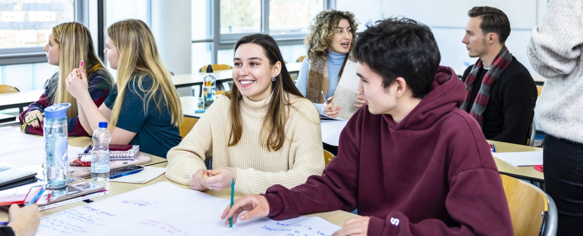 Female student laughs while present in class | Bachelor of International Social Work for international students in the Netherlands | HAN University of Applied Sciences