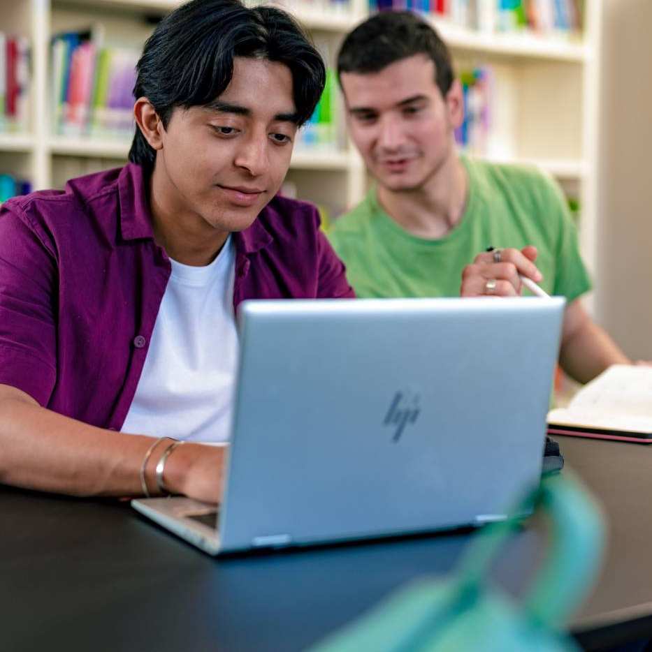 International students Diego and Andrei studying at the library on the Arnhem campus of HAN University of Applied Sciences.