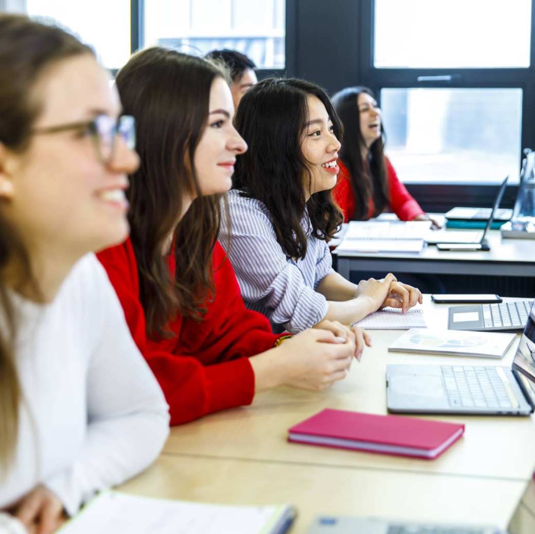 Exchange students are sitting in a classroom